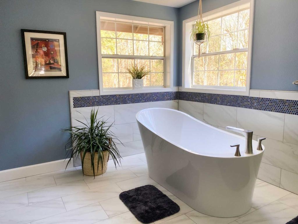Freestanding Tub in a White and Blue Master Bathroom